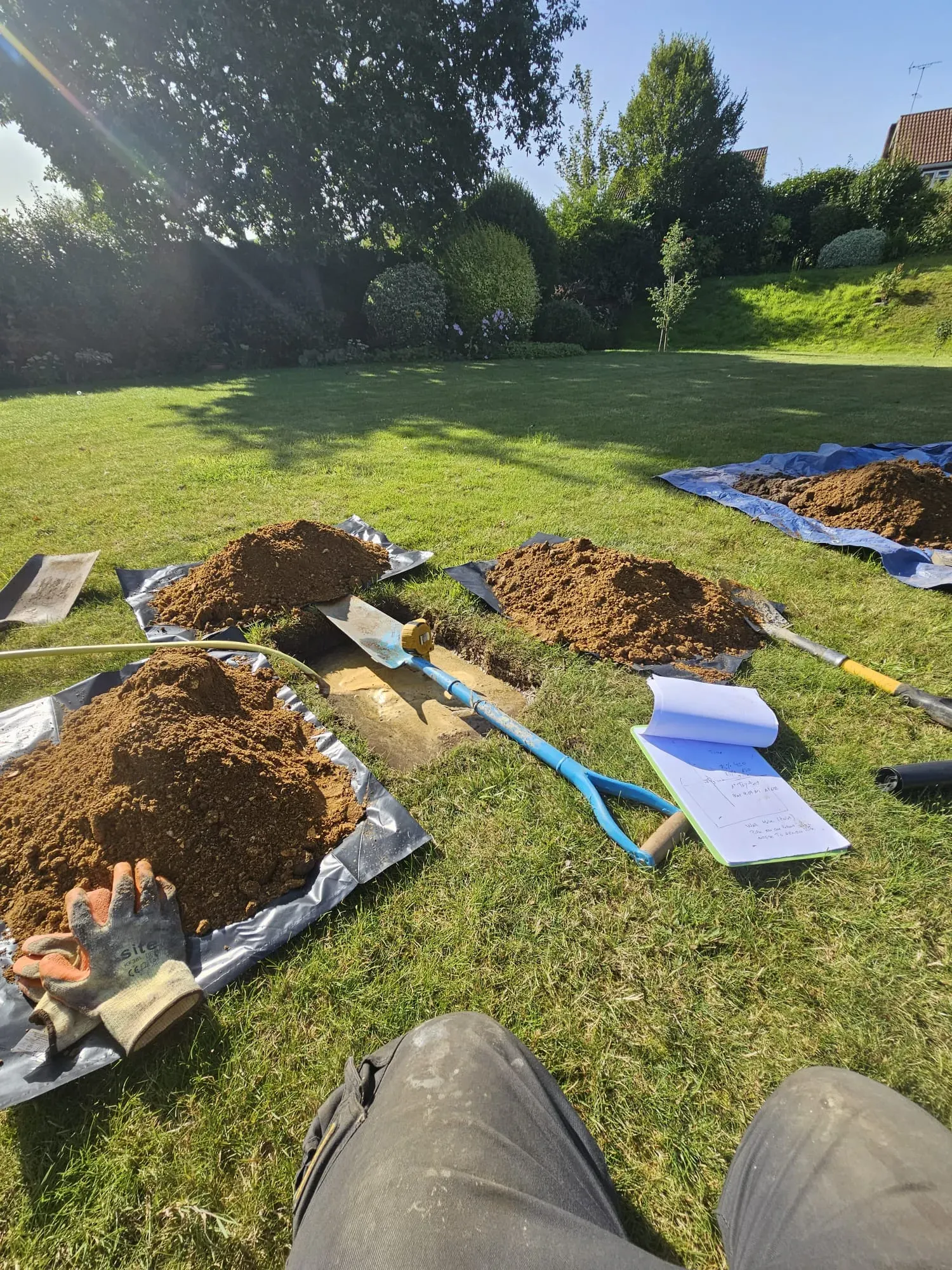 Groundworks in a garden for drainage or septic tank installation
