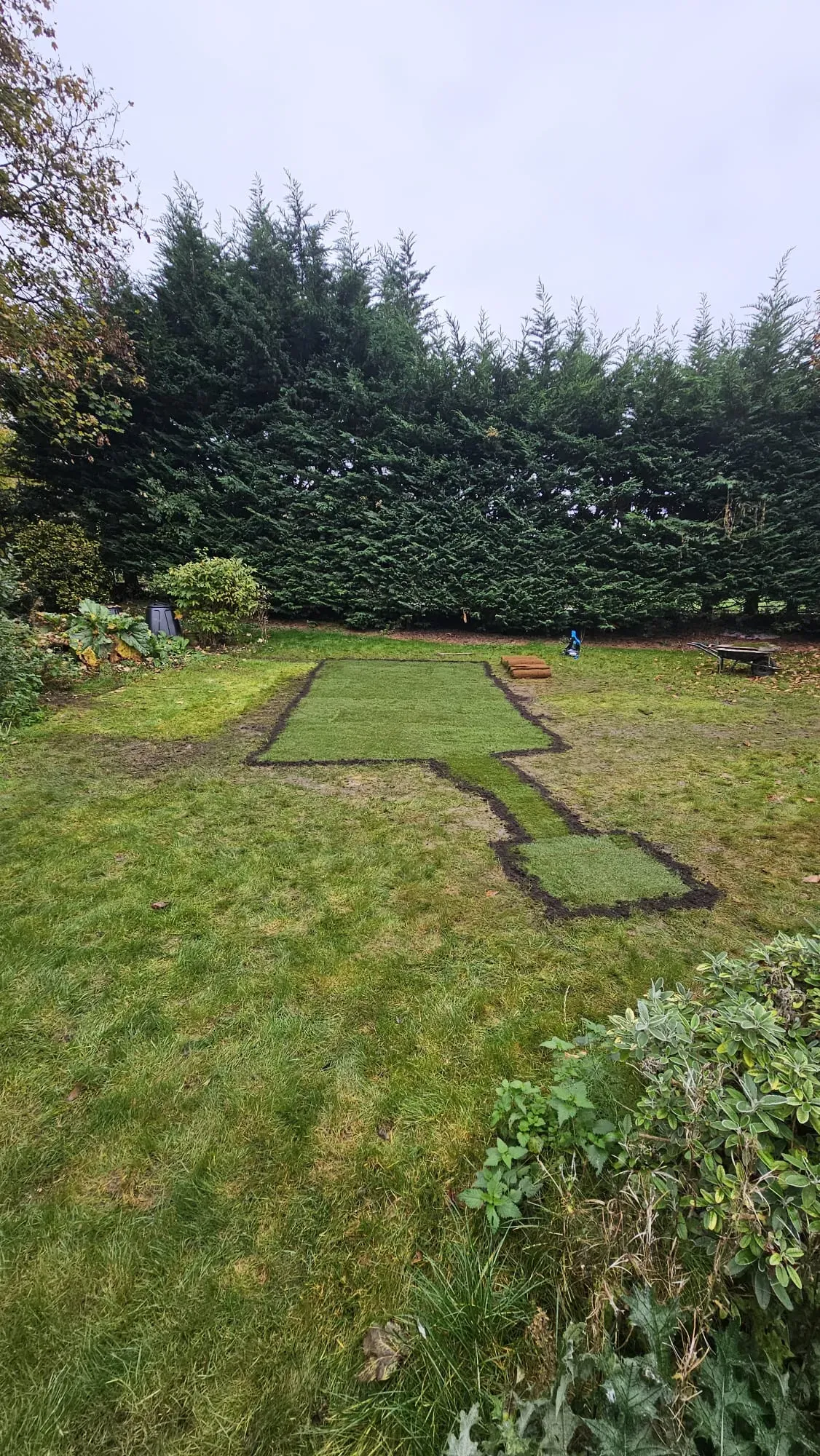 Freshly laid turf in a garden, showing the completed landscaping after drainage or groundworks project by Eco Drain Solutions Ltd.